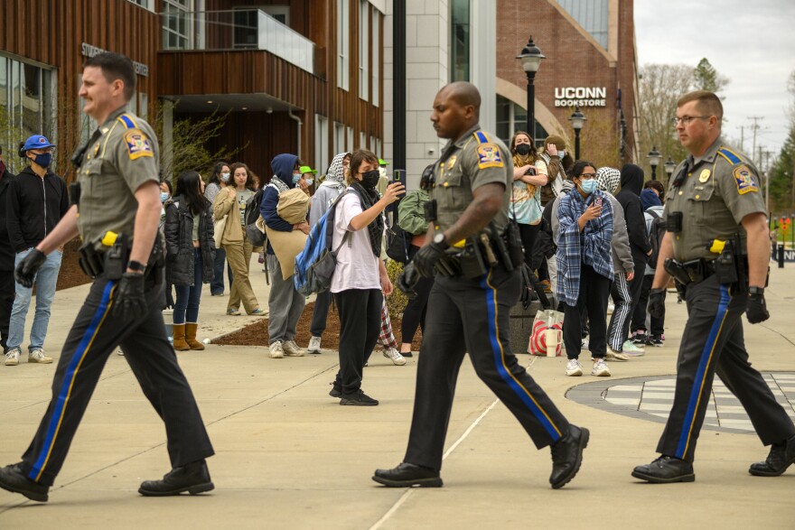 Connecticut State Police officers exit the University of Connecticut area where UConn police cleared out a pro-Palestinian encampment on April 30, 2024, that was set up four days earlier for students demanding UConn divest from any manufacturer of weapons they say are used in the Israel-Hamas war.