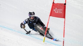 A sit-ski athlete goes down the course at the 2024 Huntsman Cup in Park City, Utah.