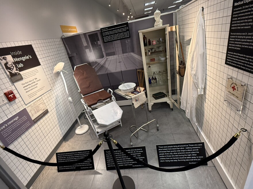 A portion of the "Inside the Lab: Medical Experiments at Auschwitz" exhibit at Candles Holocaust Museum and Education Center. The exhibit includes cold, white tiles and a Nazi Germany medical table. 