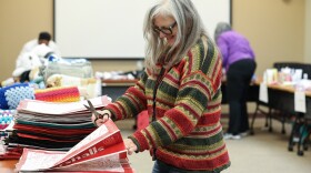 Stephanie Bowen, a Common Ground employee, helps seperate bags to be filled for older adults in nursing homes to let them know they are not forgotten. For the past three years, SACE senior volunteers have assembled and delivered “Not Forgotten” bags to residents in some of the community’s most under-resourced nursing homes. This year, students from the Rochester City School District’s Restorative H.U.B.—a program designed to support student and family needs both in and out of school—volunteered alongside them to help assemble the bags. As need continues to grow, volunteers aim to distribute 250 bags this year, up from 175 last year. The bags include new, essential items that many seniors living on Medicaid often cannot afford, such as T-shirts, socks, and personal-care supplies.