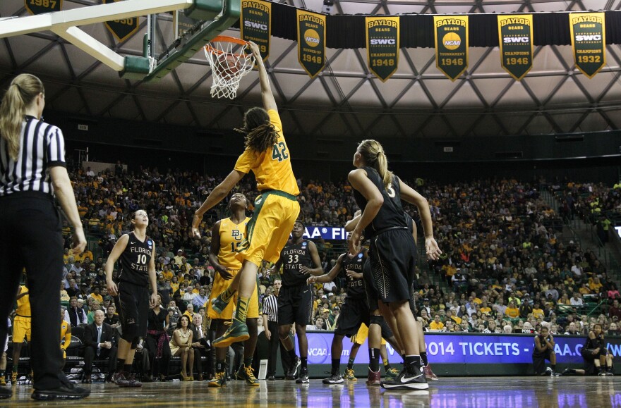 Baylor's Brittney Griner (42) dunks as Florida State's Leonore Rodriguez (10) and Alexa Deluzio (3) look on; Baylor defeated Florida State 85-47 on Tuesday in Waco, Texas.