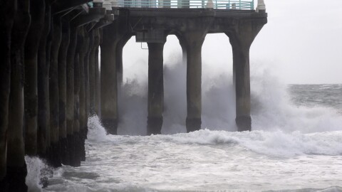 The Manhattan Beach pier is hit by high waves caused by the El Niño storm in Manhattan Beach, Calif., Wednesday, Jan. 6, 2016. 