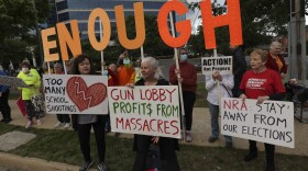 Gun-control advocates hold a vigil outside of the National Rifle Association (NRA) headquarters following the recent mass shooting at Robb Elementary School on May 25, 2022 in Fairfax, Virginia. (Kevin Dietsch/Getty Images)
