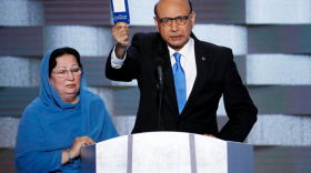 Khizr Khan, father of fallen US Army Capt. Humayun S. M. Khan speaks as his wife Ghazala listens during the final day of the Democratic National Convention in Philadelphia , Thursday, July 28, 2016.