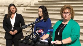 Indiana Democratic legislative candidate Joey Mayer, right, speaks during a news conference outside the Indiana Statehouse in Indianapolis on Sept. 15, 2022. Democrats such as Mayer are hoping to win legislative seats in the Nov. 8, 2022 election over Republicans who supported Indiana's abortion ban law that was approved in August.