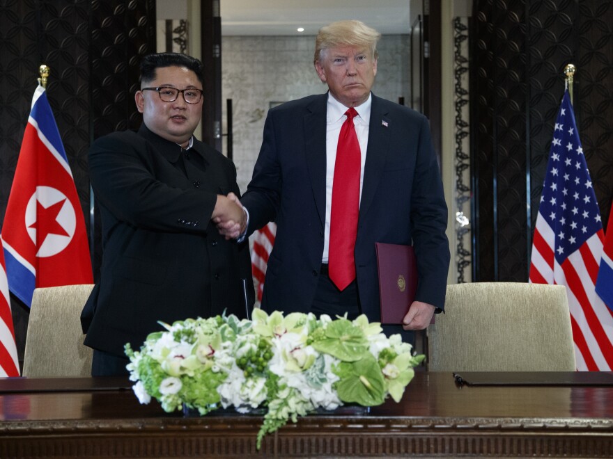 President Trump and North Korean leader Kim Jong Un shake hands during their signing ceremony in Singapore on Tuesday.