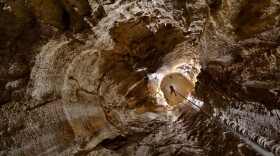 Looking down Puits Garby at caver Adam Spillane.
