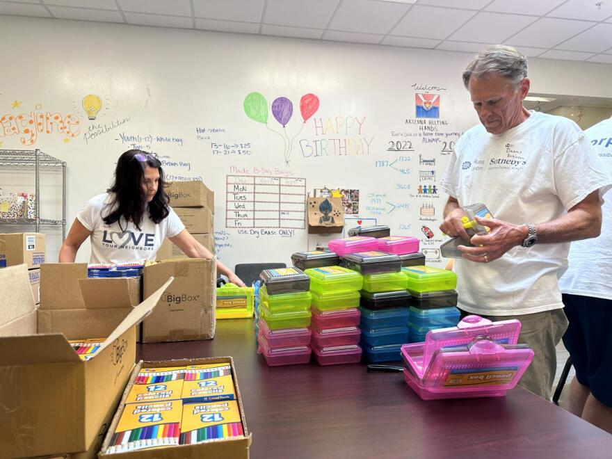 Volunteers at Arizona Helping Hands work to fill more than 4,000 backpacks with school supplies. They'll be donated to some of the state's foster families over the next few weeks.