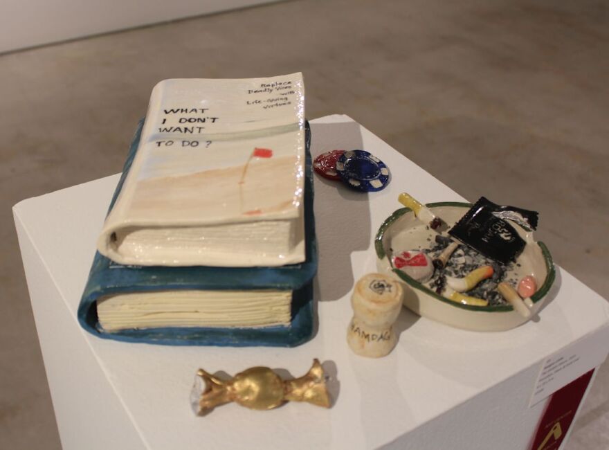 Raegan Little's porcelain, glaze and gold leaf sculptural piece, 'The Golden Mean,' received second place honors in 'Vice & Virtue.'