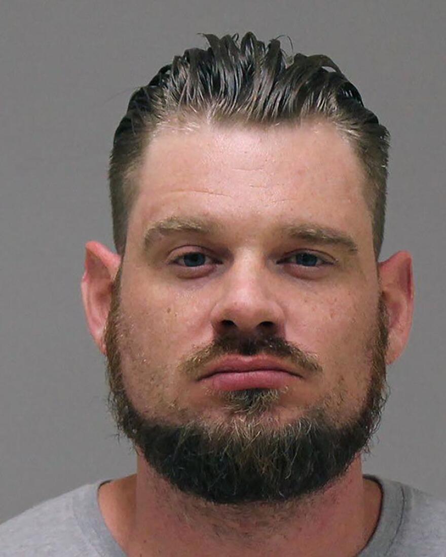 In a photo provided by the Kent County Sheriff, Adam Dean Fox is shown in a booking photo. Jury selection begins Tuesday, March 8, 2022, in the trial of four men who are accused of conspiring to snatch Michigan Gov. Gretchen Whitmer in a stunning scheme to retaliate against her stay-home policies and other COVID-19 restrictions during the early months of the pandemic.