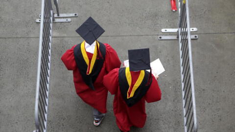 New graduates walk into the High Point Solutions Stadium before the start of the Rutgers University graduation ceremony in Piscataway Township, New Jersey. (Seth Wenig/AP)