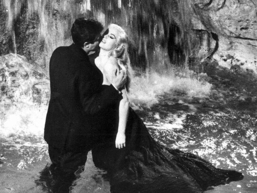 In director Federico Fellini<em></em>'s 1960 film <em>La Dolce Vita</em>, another journalist (Marcello Mastroianni) avails himself of the beauty of Rome, including Sylvia (Anita Ekberg) and the city's famous Fontana di Trevi.