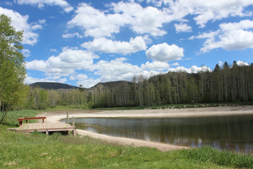 The dock at Coulter Lake Guest Ranch north of Rifle hangs over empty space on May 29, 2026. Its owner says the low-snow winter had a serious impact on its recreation business.