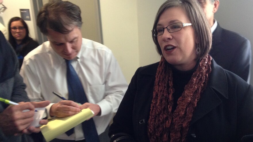 Kansas can't deny same-sex couples' requests for a marriage license, a federal judge ruled Tuesday. Kerry Wilks (right), one of four women represented by the American Civil Liberties Union in a lawsuit against the ban, spoke with reporters after a hearing Friday.