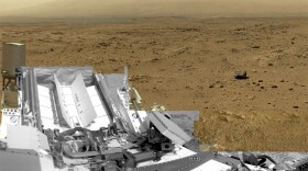 A photo composed of nearly 900 images taken by the rover Curiosity shows a section of Gale Crater near the equator of Mars. The rovers are continuing to work through the U.S. government shutdown.
