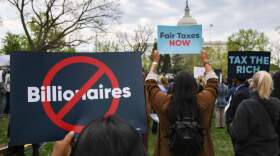People attend a press conference and rally in support of fair taxation near the U.S. Capitol in Washington, D.C. on April 10, 2025. Tax justice advocates attended the 'Federal Fight Back Rally' to speak out against President Trump's tax cuts for the wealthy, and to urge members of Congress to intervene. (Bryan Dozier/Middle East Images/AFP via Getty Images)