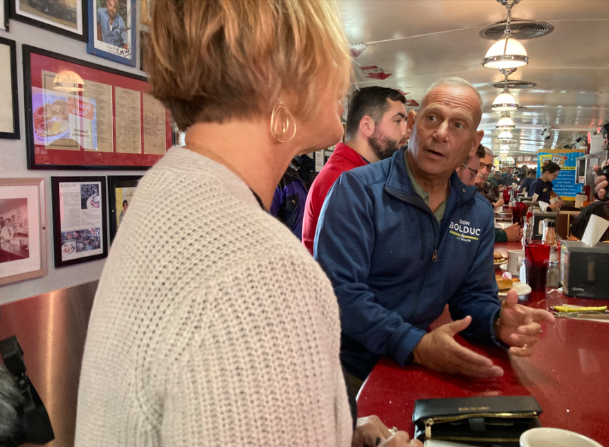 Republican Senate candidate Don Bolduc talks to patrons at the Red Arrow Diner in Manchester, Oct. 3, 2022.