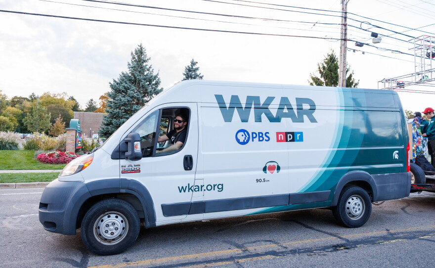 WKAR Senior Director of Station Operations Brant Wells drives the joint WKAR and College of Communication Arts and Sciences float in the Michigan State University Homecoming Parade in East Lansing, Mich., on Oct. 9, 2026.