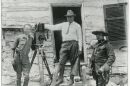 Oscar Micheaux (center) with an actor and possibly a crew member