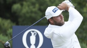 Daniel Brown of England hits off the 12th tee during his opening round of the British Open Golf Championships at Royal Troon golf club in Troon, Scotland, Thursday, July 18, 2024. (AP Photo/Jon Super)