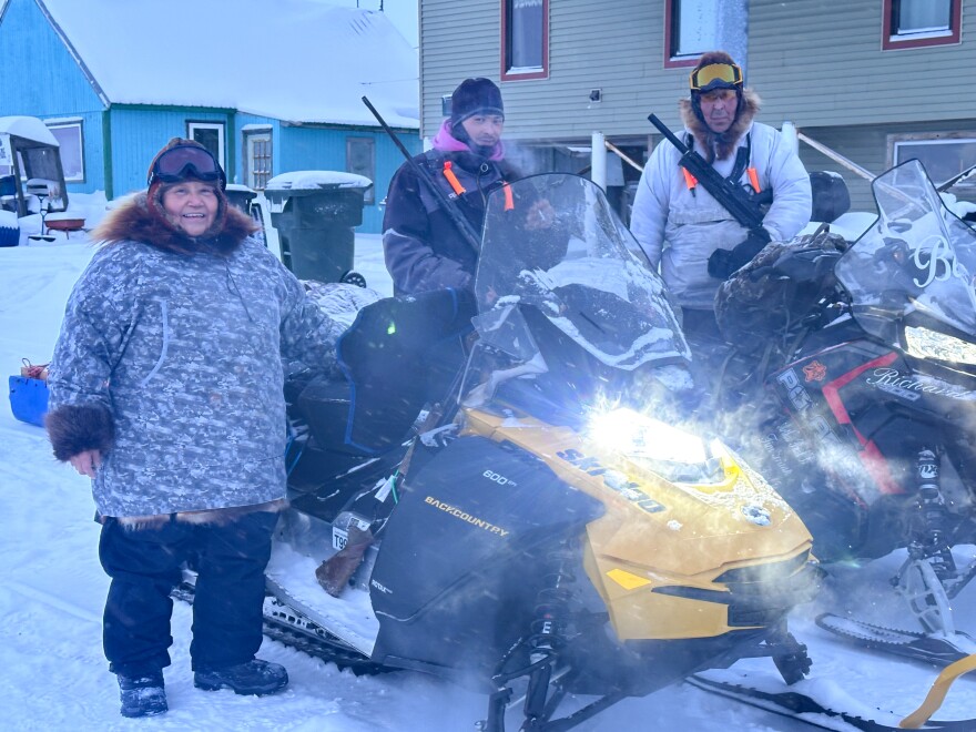 Aucha Kameroff, Arthur Richards Sr. and Raymond Brown Jr. pose for a photo in Kotzebue on Feb. 12