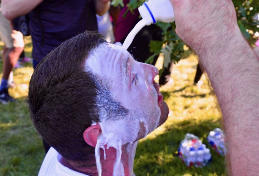 Anton Slobodnick washes his eyes out with milk after getting pepper sprayed by police Sunday afternoon. An Iraq War veteran, Slobodnick said if police are dealing with civilians in this way, they’re not doing their job right. He said that he and others were standing off the curb on J.C. Nichols Parkway and were sprayed when they didn’t immediately go back to the curb. 