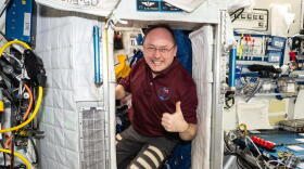 NASA astronaut and Expedition 73 Flight Engineer Mike Fincke poses for a portrait inside his crew quarters aboard the International Space Station's Harmony module.