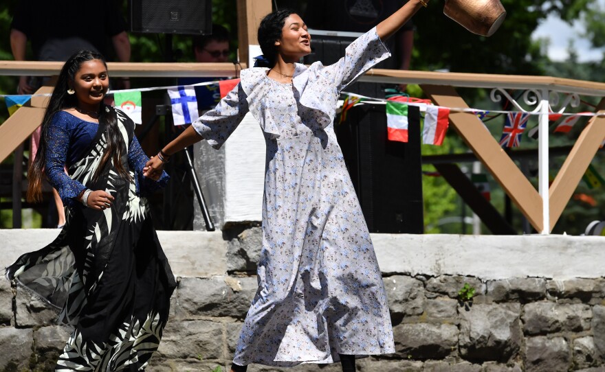 Sristee, 10, and Bhawana Lagun, 16, of Nepal perform a cultural dance.