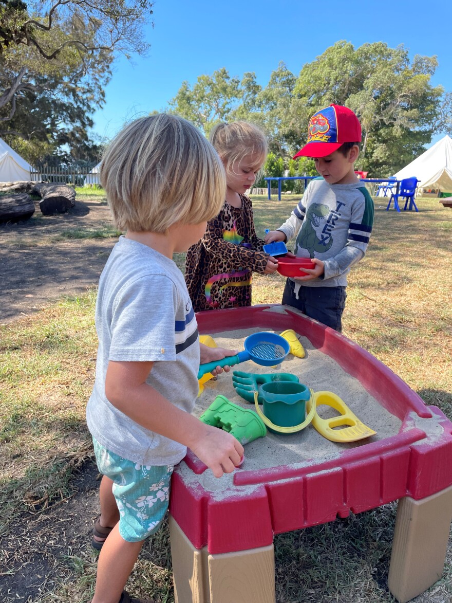 3 to 5 year-olds play outside at the pre-school