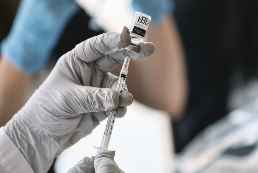 Registered pharmacist Sapana Patel, loads a syringe with monkeypox vaccine at a pop-up vaccination site on Wednesday, Aug. 3, 2022, in West Hollywood, Calif.