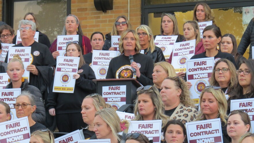 Math teacher Amy Brossart speaks alongside dozens of Ross teachers.
