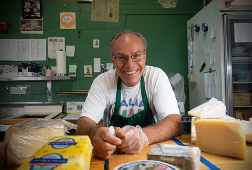 Vincenzo Giordano at the cheese counter of VM Giordano Imports Inc., which he opened in the Rochester Public Market nearly 30 years ago.