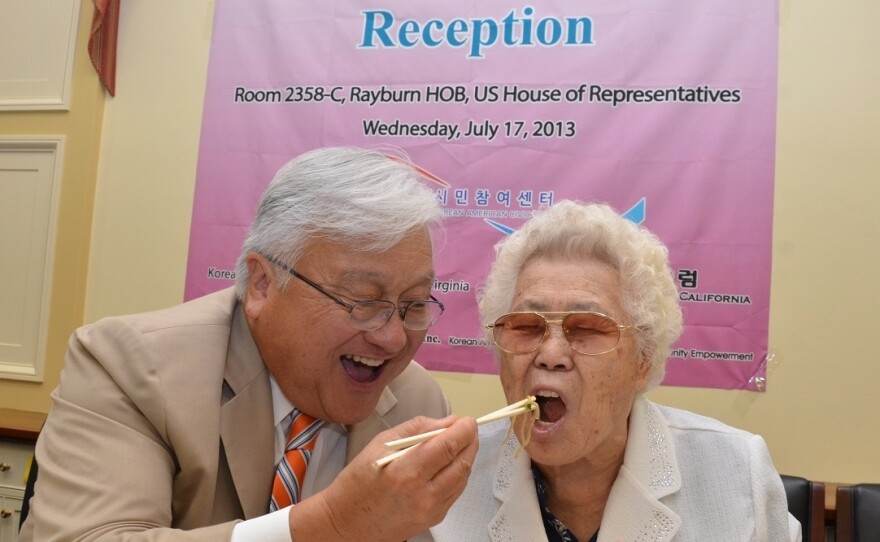 Rep. Mike Honda, D-Calif., and Ok-seon Lee, who says she was forced into sex slavery during World War II, celebrate the anniversary of a 2007 House resolution that asks the Japanese government to apologize to comfort women.