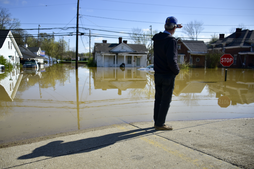 A man looking out over flooding in Frankfort, Kentucky, on Monday April 7, 2025.