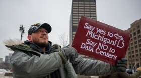 Protesters gathered near DTE Energy's Detroit headquarters to oppose the utility's plan for providing power to a proposed data center in rural Washtenaw County.