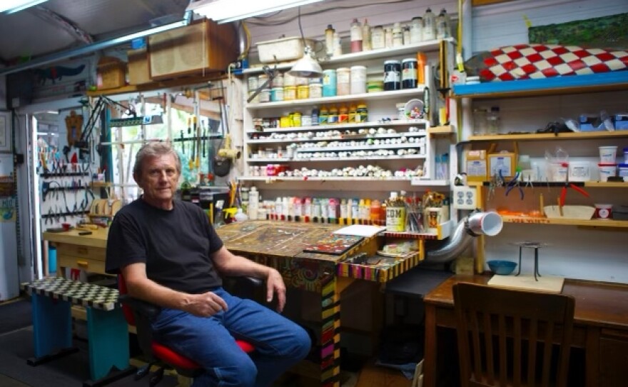 Artist Ben Peabody seated in his studio