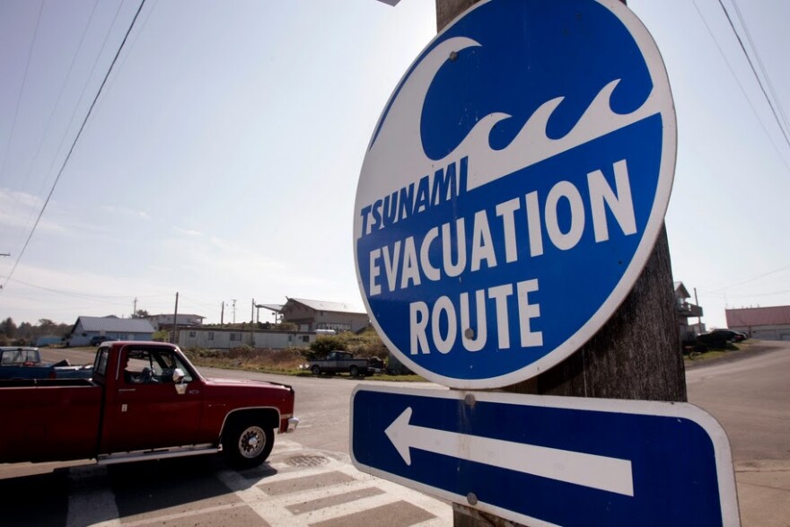 A tsunami evacuation sign in Grays Harbor County, on Washington's coast. There have been limited evacuations, as a surge of 4 feet is expected this morning.