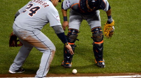 Please go foul, please go foul, please go foul: Third-baseman Miguel Cabrera (No. 24) and catcher Gerald Laird of the Detroit Tigers watched closely to see if a bunt by the Giants' Gregor Blanco would go foul Thursday night in San Francisco. It didn't. The Giants scored and went on to win the game and take a 2-0 lead in the World Series.
