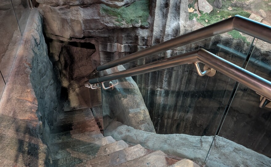 Stairs going down into a replica cave.