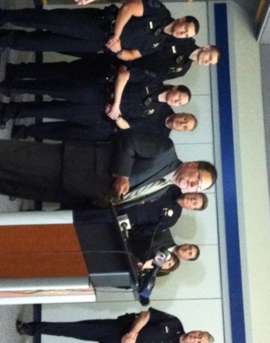 Arrests are announced by Sex Crimes Unit Sargeant Mark Mears as Chief Chuck Jordan and others watch.