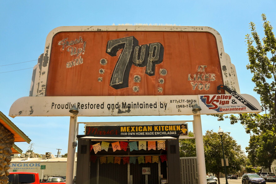 The 7UP billboard in Merced sits on Main Street next to the restaurant Maria’s Mexican Kitchen.