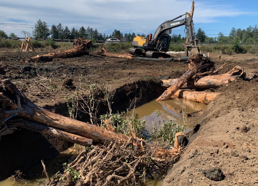 A $1.5 million habitat restoration project spearheaded by the MidCoast Watershed Council and the U.S. Fish and Wildlife Service on the Siletz Bay National Wildlife Refuge receives final touches during the construction phase as crews add large wood debris to serve as habitat for fish and wildlife.