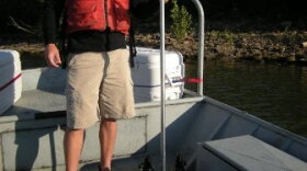 Researcher collecting water samples
