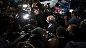 Democratic presidential candidate Sen. Bernie Sanders of Vermont is surrounded by media following a debate in Charleston, S.C., on Tuesday. Feb. 25. 