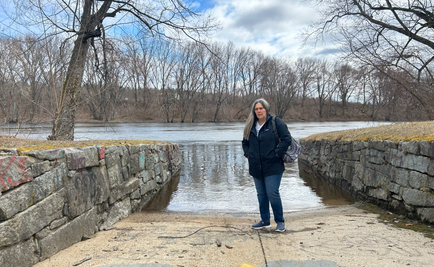 Laurene Allen stands near the Merrimack River in Merrimack, N.H.