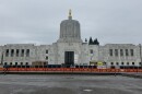 Oregon Capitol building as pictured from across Court Street. Construction equipment is visible in the front plaza.