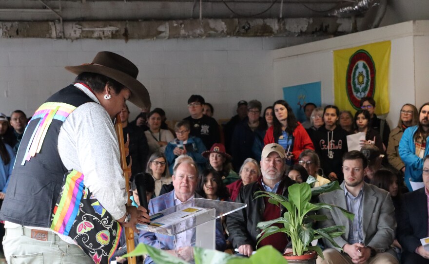Jarrett Wildcatt, an enrolled member of the Eastern Band of Cherokee Indians, plays his flute at the beginning of the deed-signing ceremony in Franklin on February 26, 2026.
