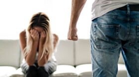 A man beating up his wife illustrates domestic violence.