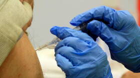 A client recieves a flu shot