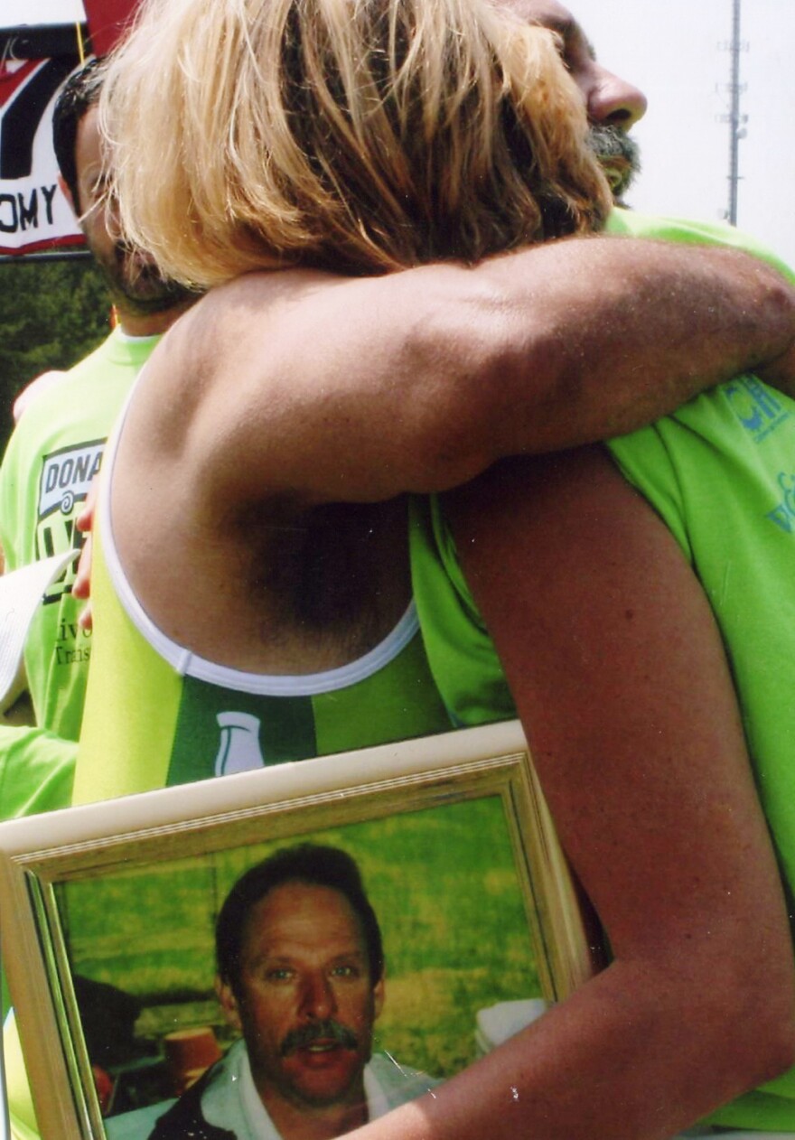 Dorothy met Rick at the finish line of his first triathlon, holding a photo of her late husband, Marty.